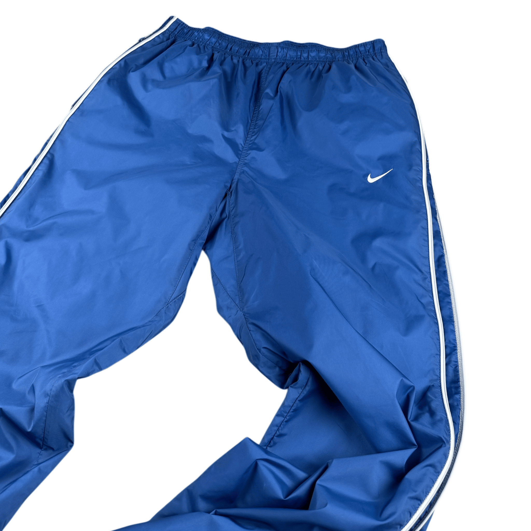 Nahaufnahme der oberen Vorderseite mit elastischem Bund und Swoosh-Logo – Nike Trackpants in Blau, Größe L
